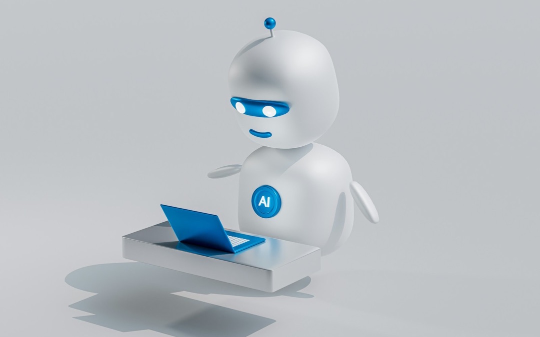 Robot blanc et bleu portant la mention AI, devant un ordinateur portable : illustration d’un chatbot