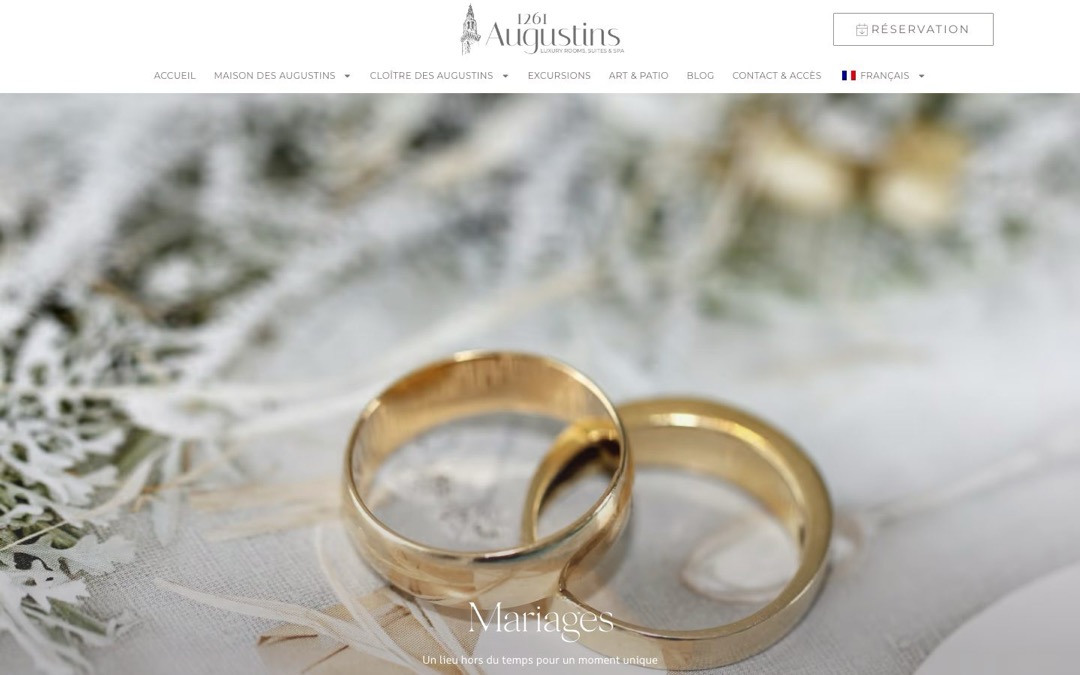 Page Mariages du site des Augustins 1261 : deux alliances posées sur un tissu clair