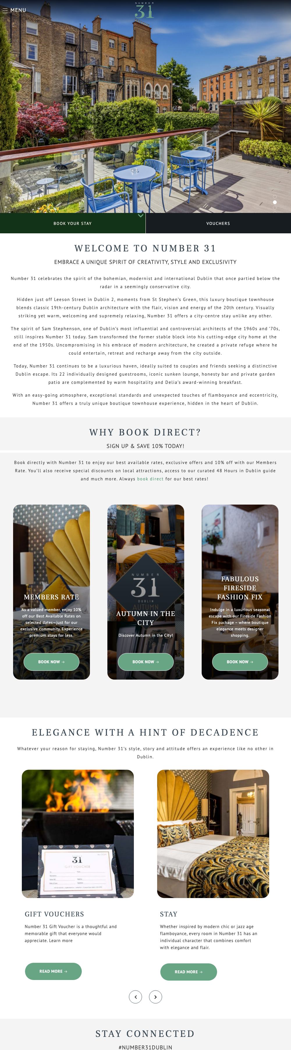 Desktop view of the Number 31 home page: a full-screen photo of a terrace with blue tables and chairs above a Book Your Stay bar and a Vouchers button, then the story of the house and the Why Book Direct? section