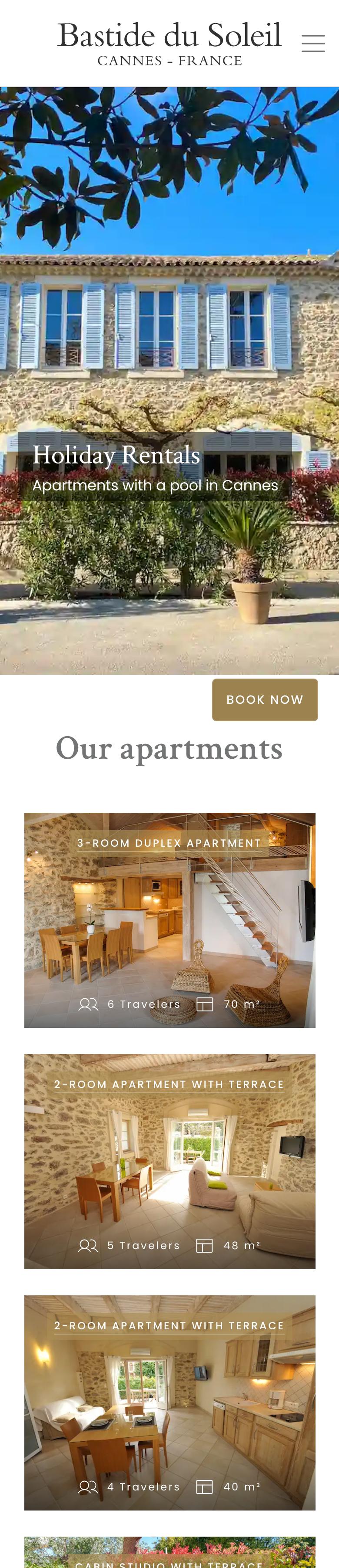 Full home page of the La Bastide du Soleil website on a phone, with the apartment cards stacked one under the other