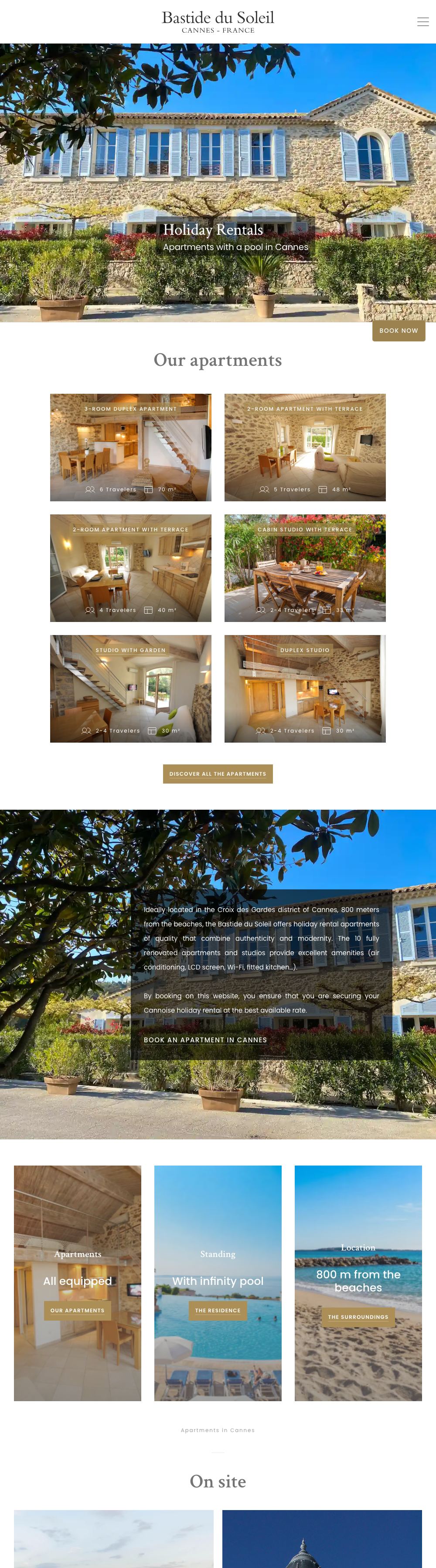 Full home page of the La Bastide du Soleil website on a desktop computer: the façade of the building with a Book now tab, then the apartment cards with travelers and floor area